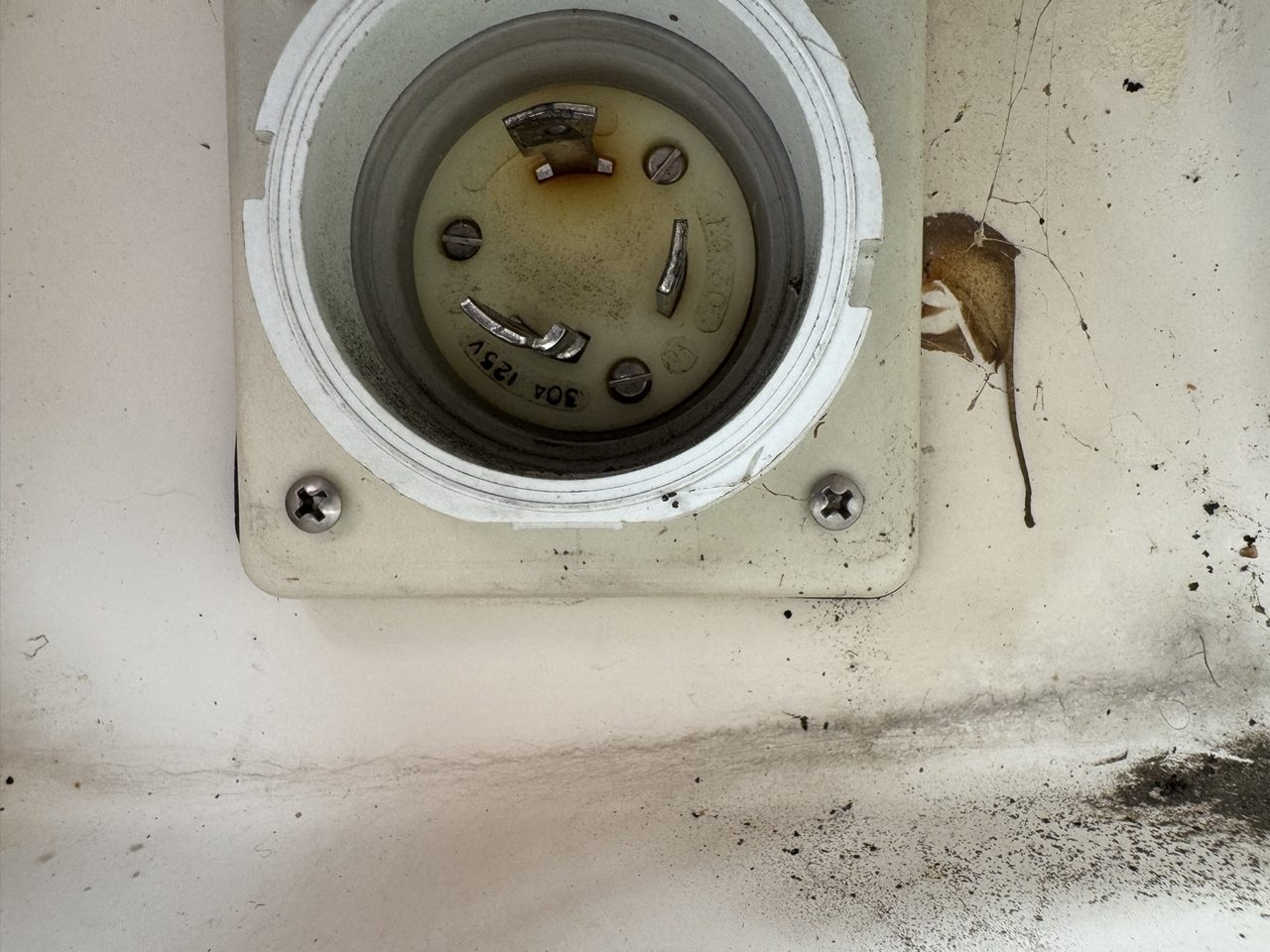 Scorched contacts inside the original shore-power inlet