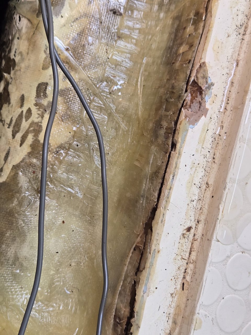 Cracked fiberglass repair beside the cabin sole