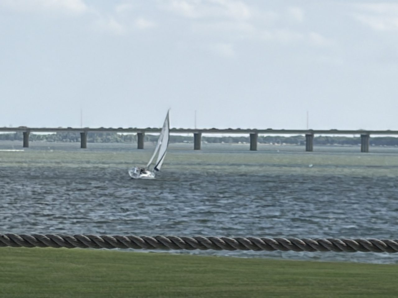 Standing over towards the toll bridge, in the only photographs of Swallow sailing that exist so far.