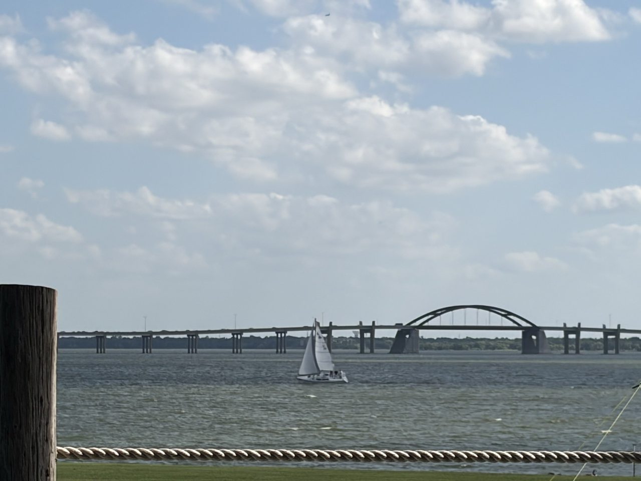 The sea trial, from the shore: full sail and going somewhere. You cannot tell at this distance, but that is me sailing her.