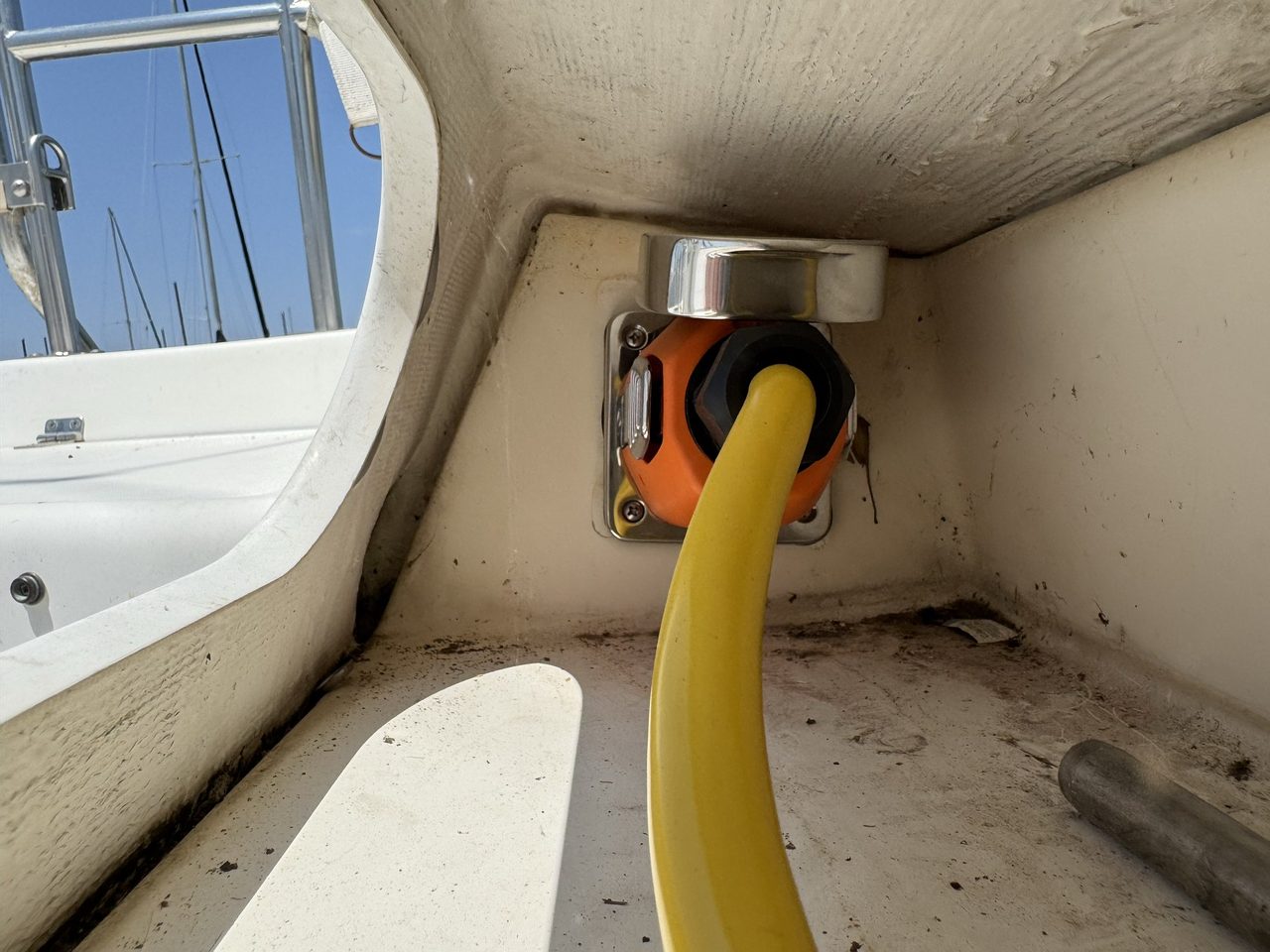 The new SmartPlug shore-power inlet fitted in the cockpit recess with the yellow pigtail plugged in