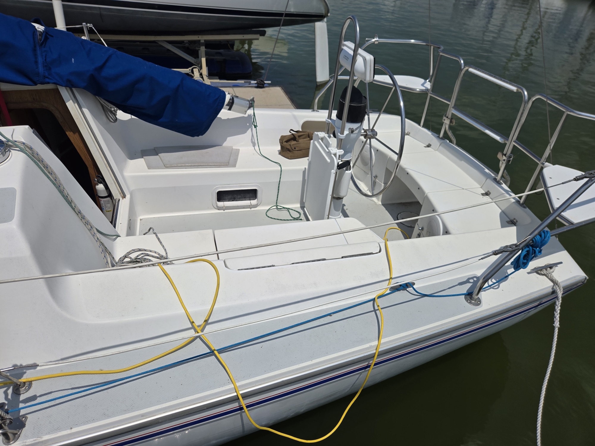 Cockpit and pedestal from the dock. Wheel steering was a hard requirement in the search.