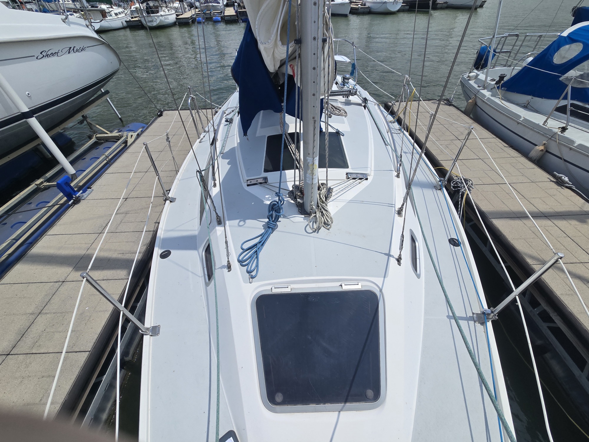Foredeck and coachroof. The big forward hatch is a fine thing on a hot night, once it stops leaking.